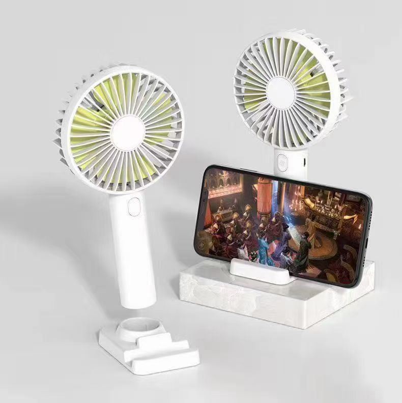 USB rechargeable fan with stand, compact portable cooling fan from سوق كوم, ideal for personal cooling.
