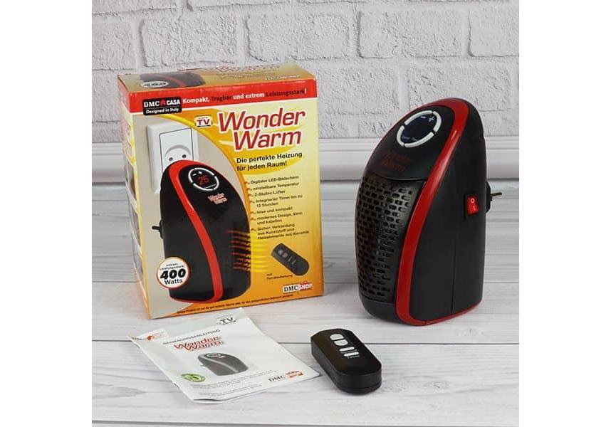Modern Wonder Warm heater from سوق كوم, sleek design with digital display and adjustable temperature controls.