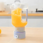 Mini Juicer blender from سوق كوم, compact kitchen tool with a transparent container and blending blade for fresh juice.