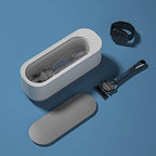 Ultrasonic multi-purpose cleaning and disinfecting device from سوق كوم, handheld tool with control buttons and cleaning surface.