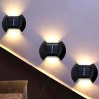 Outdoor solar wall light by سوق كوم, solar-powered exterior illumination fixture mounted on a wall setting.