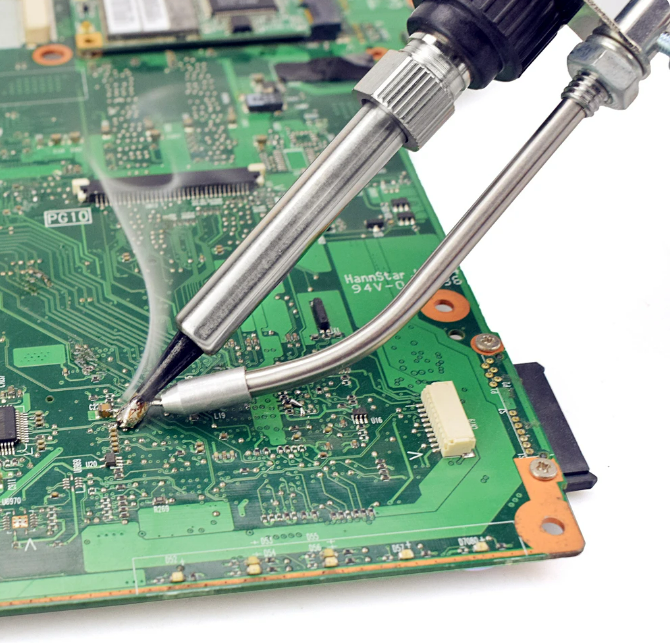 Electric soldering iron from TOTAL, a handheld tool used for precise electrical and electronic soldering tasks.