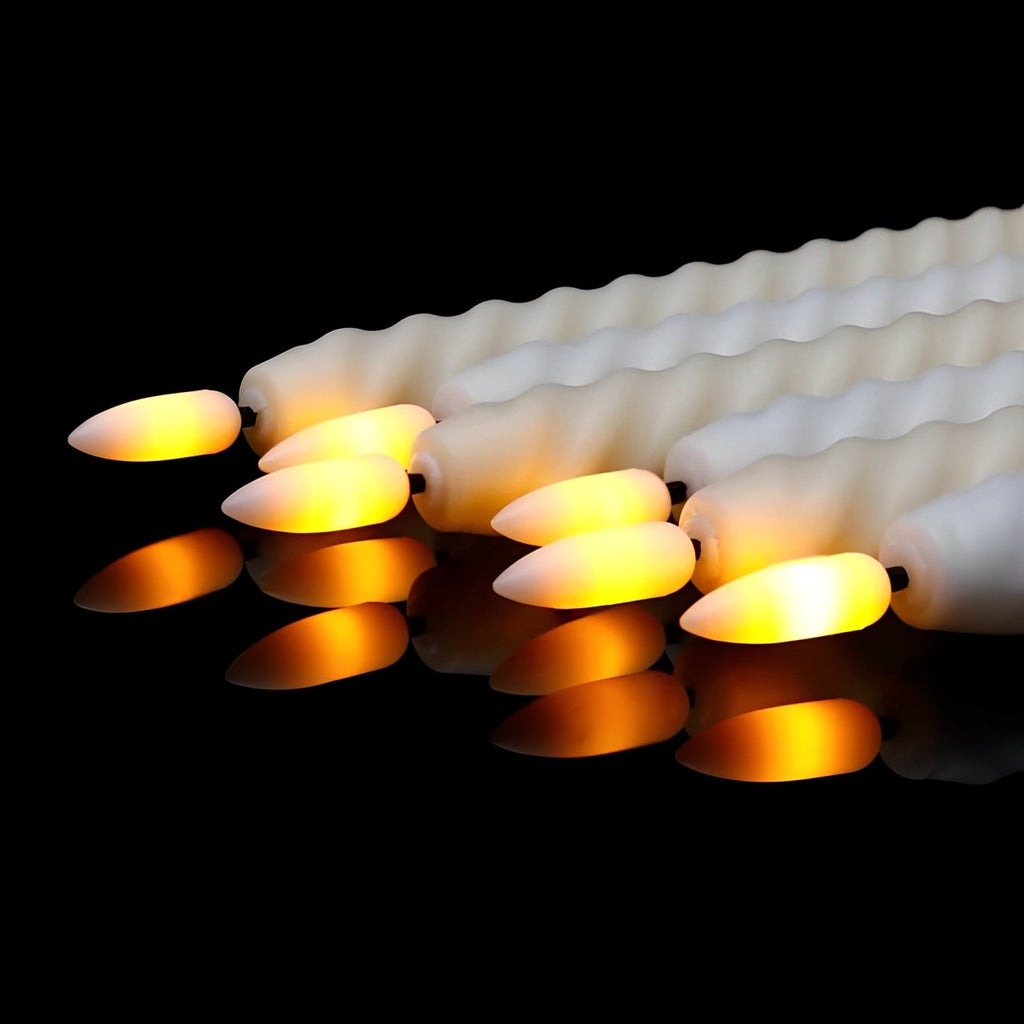 LED candle decor set with three white candles in glass holders, ideal for home decoration and ambient lighting.