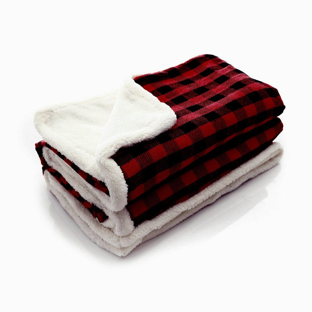 Modern Christmas blanket from سوق كوم, showcasing festive woven textiles with holiday patterns and cozy fabric.