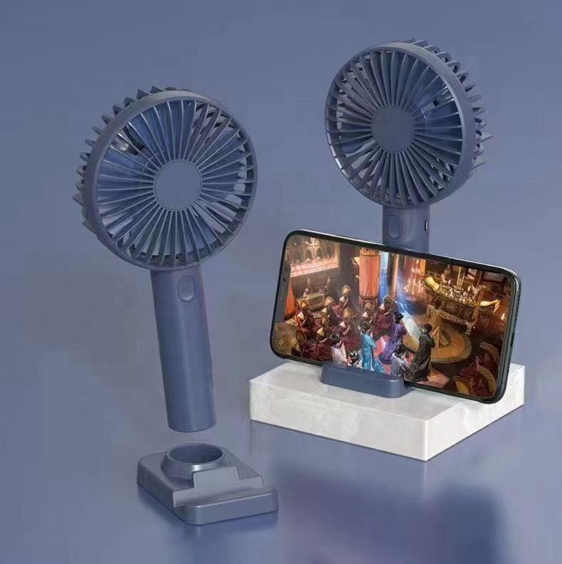 USB rechargeable fan with stand, portable cooling fan from سوق كوم, compact and ideal for personal cooling.