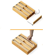 Wooden triple foil holder for kitchen storage, with three compartments for organizing aluminum foil rolls.