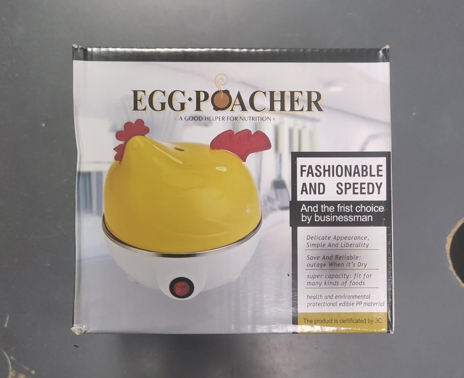 Electric egg cooker in the shape of a chicken, compact and easy to use, from the brand سوق كوم, suitable for boiling eggs efficiently.